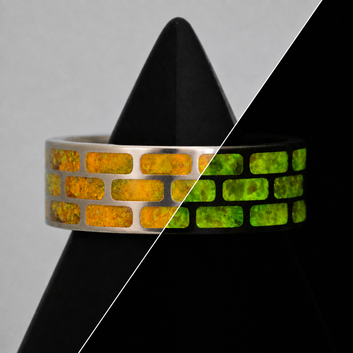 Yellow Brick Road ring shown lit and glowing, a titanium brick wall blank inlaid with crushed opal and yellow glow powder